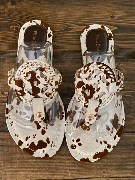 COURTNEY COW PRINT FLIP FLOPS