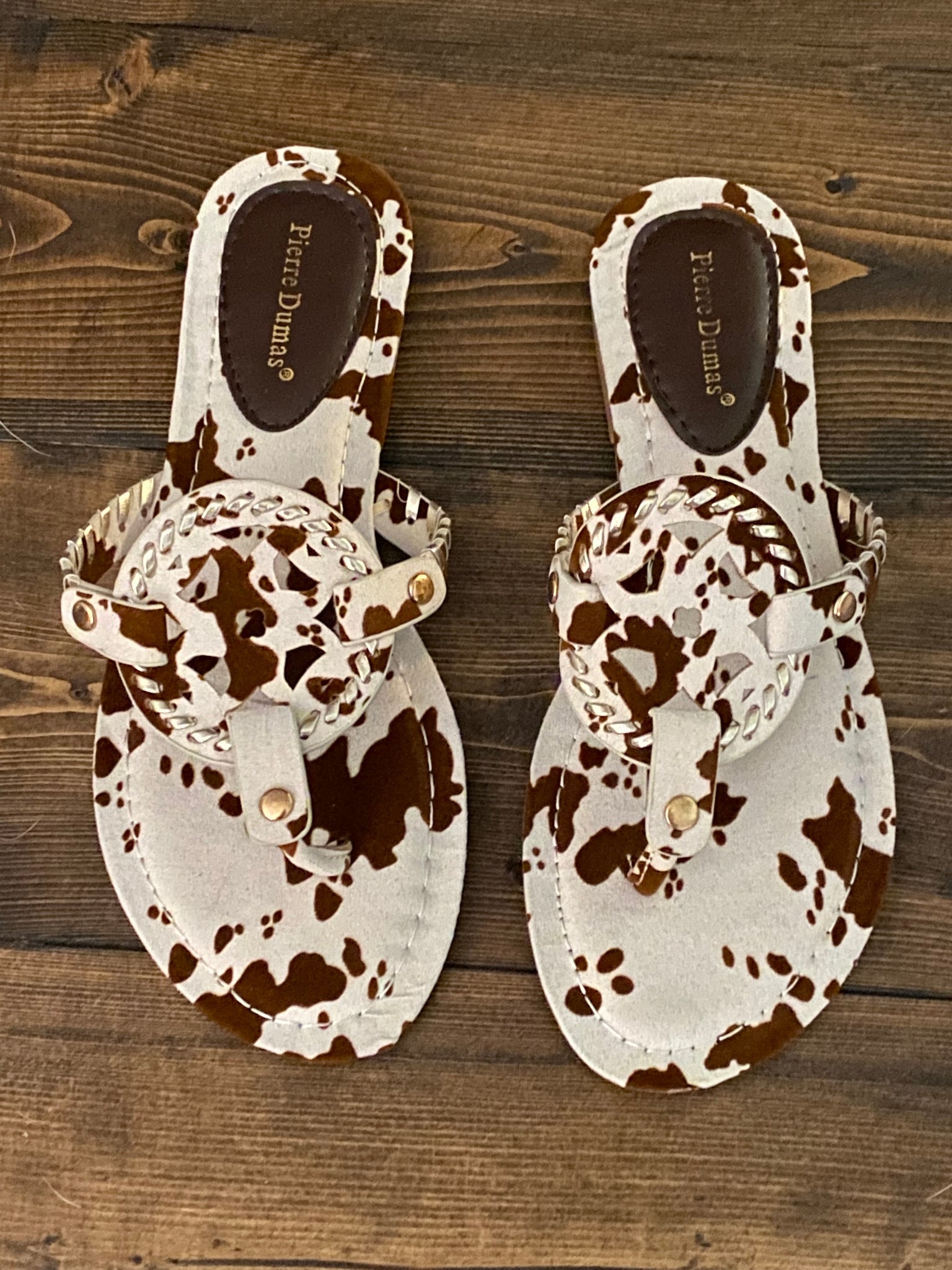 COURTNEY COW PRINT FLIP FLOPS